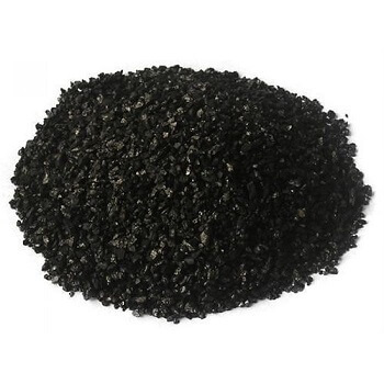 A photo showing a pile of granular activated carbon on a white background