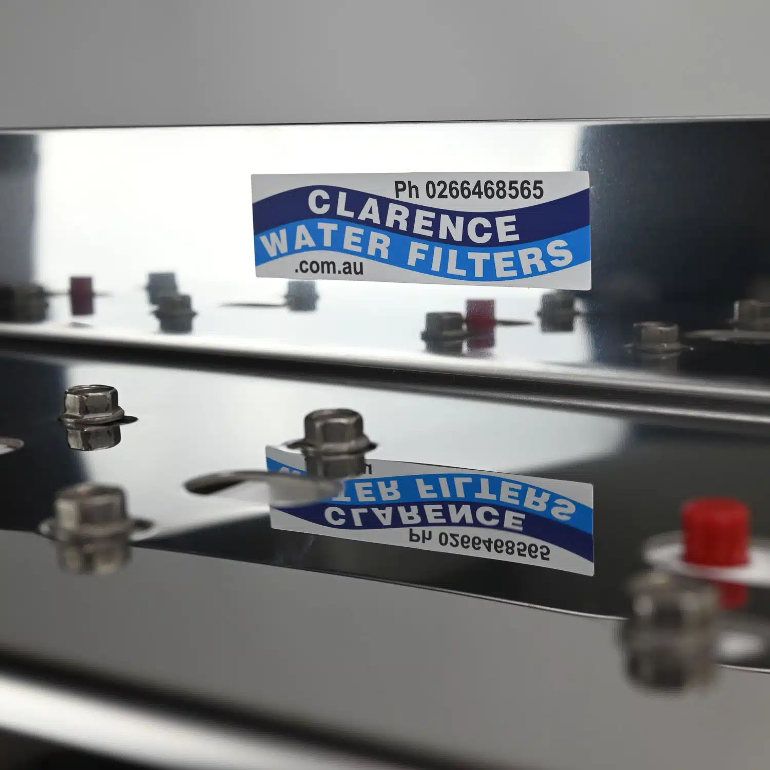 Pentair Big White 20 inch by 4 point 5 inch triple water filter housing with 1 in ch ports on a stainless bracket-01