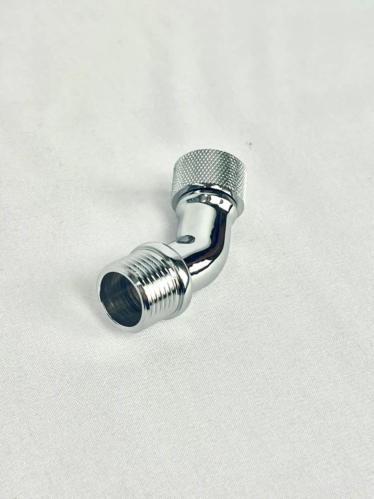 Chromed Brass 45 Degree Angle Elbow that has Swivel Lock Nut.